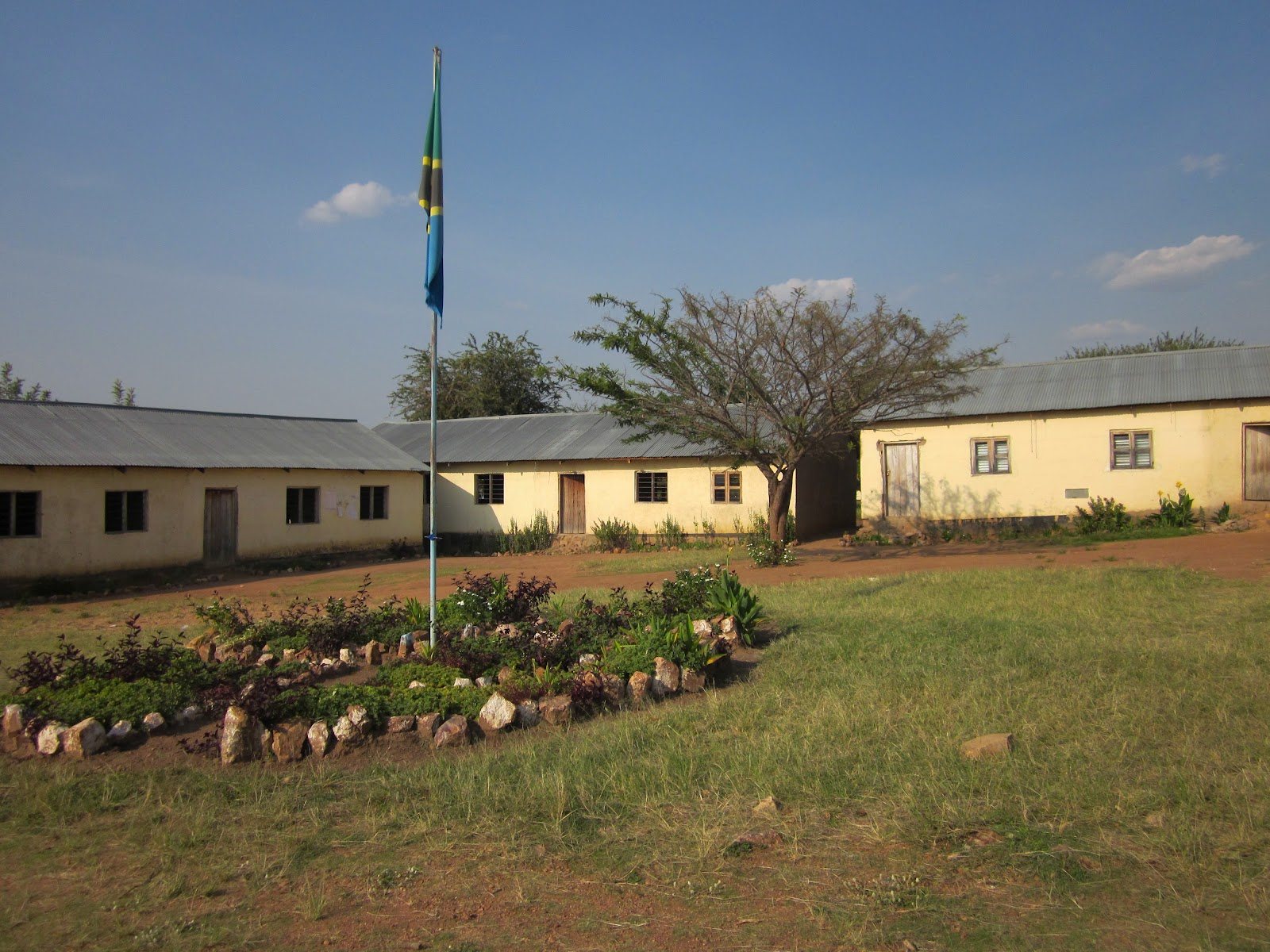 School buildings and a flagpole in a member village